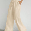 Pantalones sueltos de pierna ancha de color solido para mujer con dobladillo fluido, estilo casual