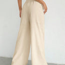 Pantalones sueltos de pierna ancha de color solido para mujer con dobladillo fluido, estilo casual
