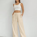 Pantalones sueltos de pierna ancha de color solido para mujer con dobladillo fluido, estilo casual