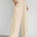 Pantalones sueltos de pierna ancha de color solido para mujer con dobladillo fluido, estilo casual