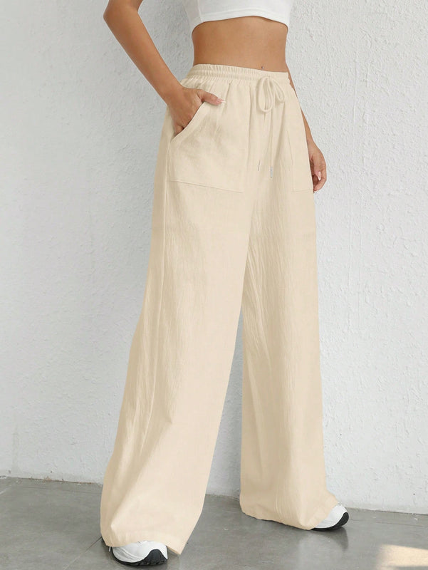 Pantalones sueltos de pierna ancha de color solido para mujer con dobladillo fluido, estilo casual