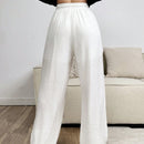 Pantalones sueltos de pierna ancha de color solido para mujer con dobladillo fluido, estilo casual