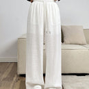 Pantalones sueltos de pierna ancha de color solido para mujer con dobladillo fluido, estilo casual