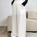 Pantalones sueltos de pierna ancha de color solido para mujer con dobladillo fluido, estilo casual