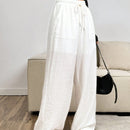 Pantalones sueltos de pierna ancha de color solido para mujer con dobladillo fluido, estilo casual
