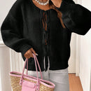Frenchy cardigan de punto unicolor de color rosa palido con cinturon delantero, se puede usar sobre una camiseta