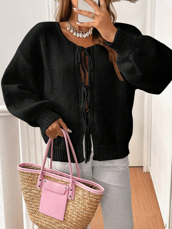Frenchy cardigan de punto unicolor de color rosa palido con cinturon delantero, se puede usar sobre una camiseta