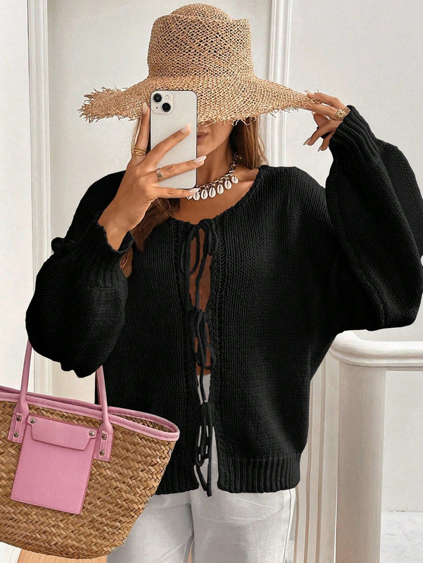 Frenchy cardigan de punto unicolor de color rosa palido con cinturon delantero, se puede usar sobre una camiseta
