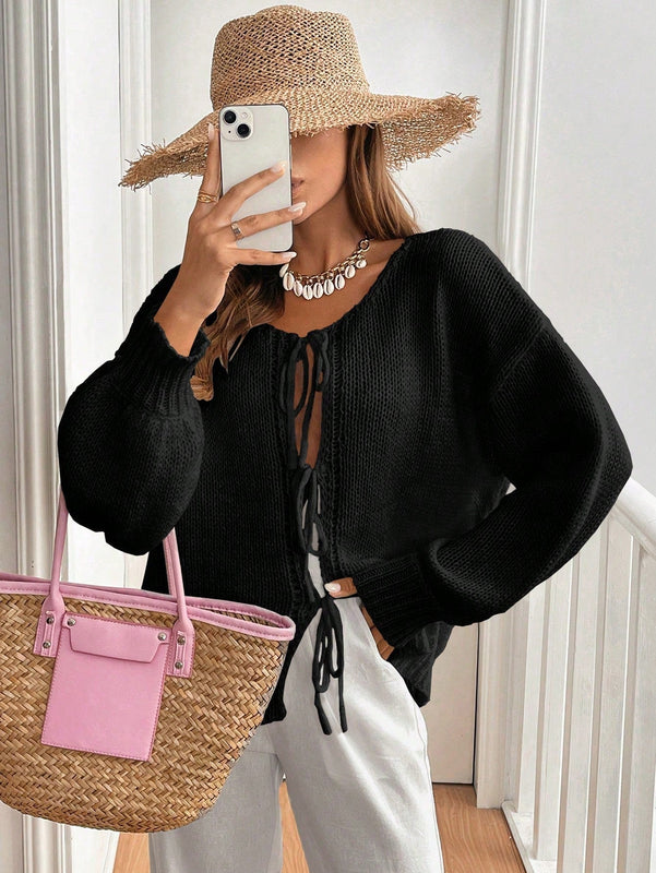 Frenchy cardigan de punto unicolor de color rosa palido con cinturon delantero, se puede usar sobre una camiseta