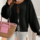 Frenchy cardigan de punto unicolor de color rosa palido con cinturon delantero, se puede usar sobre una camiseta