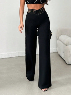 Tejido de lycra punto suelto negro, pantalon ancho cinturon elastico raya semitransparente y cintura en forma de v