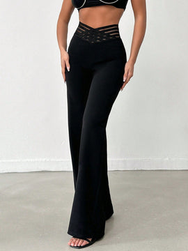 Tejido de lycra punto suelto negro, pantalon ancho cinturon elastico raya semitransparente y cintura en forma de v