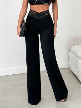 Tejido de lycra punto suelto negro, pantalon ancho cinturon elastico raya semitransparente y cintura en forma de v