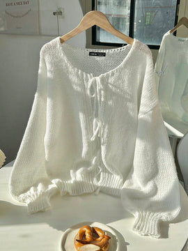 Frenchy cardigan de punto unicolor de color rosa palido con cinturon delantero, se puede usar sobre una camiseta