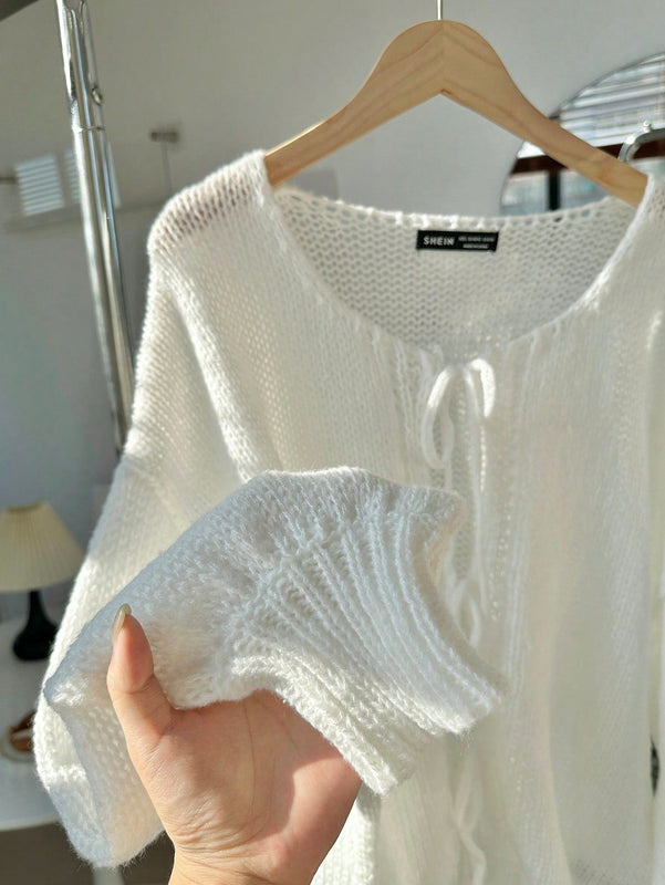 Frenchy cardigan de punto unicolor de color rosa palido con cinturon delantero, se puede usar sobre una camiseta