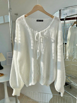 Frenchy cardigan de punto unicolor de color rosa palido con cinturon delantero, se puede usar sobre una camiseta