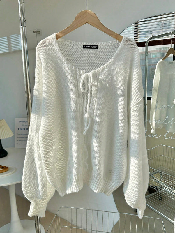 Frenchy cardigan de punto unicolor de color rosa palido con cinturon delantero, se puede usar sobre una camiseta