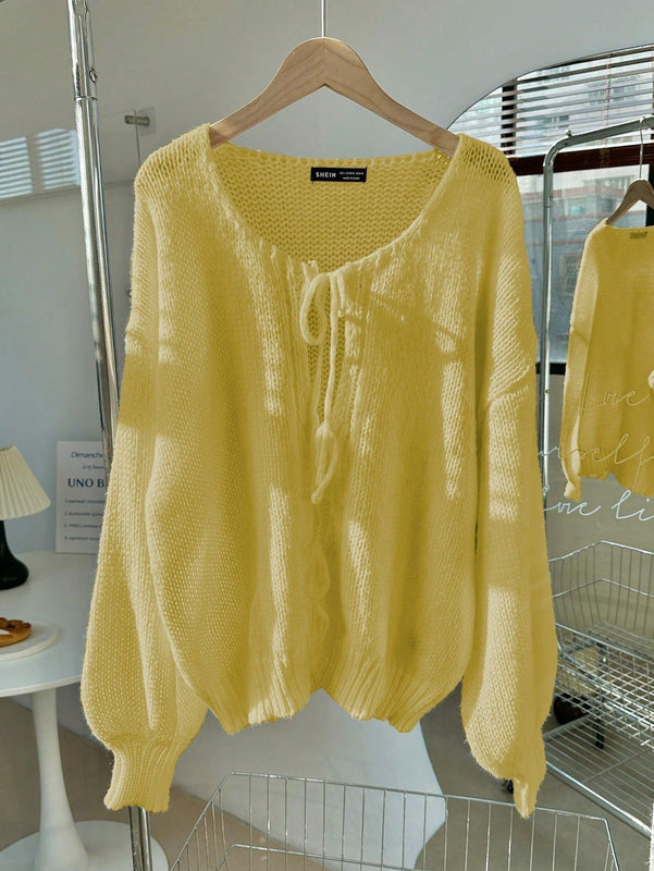 Frenchy cardigan de punto unicolor de color rosa palido con cinturon delantero, se puede usar sobre una camiseta