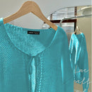Frenchy cardigan de punto unicolor de color rosa palido con cinturon delantero, se puede usar sobre una camiseta