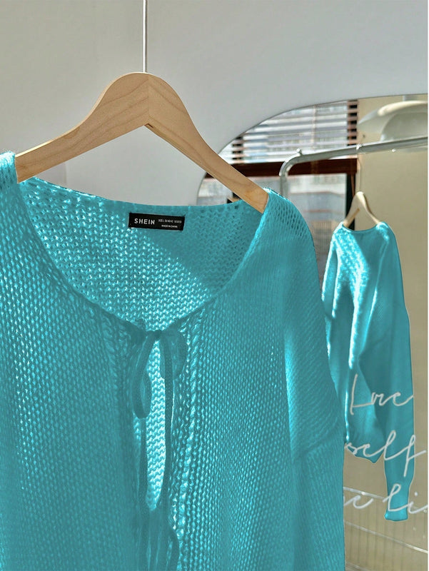 Frenchy cardigan de punto unicolor de color rosa palido con cinturon delantero, se puede usar sobre una camiseta