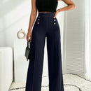 Pantalon palazzo de pierna ancha blanco con detalle de boton