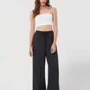 Pantalones sueltos de pierna ancha de color solido para mujer con dobladillo fluido, estilo casual