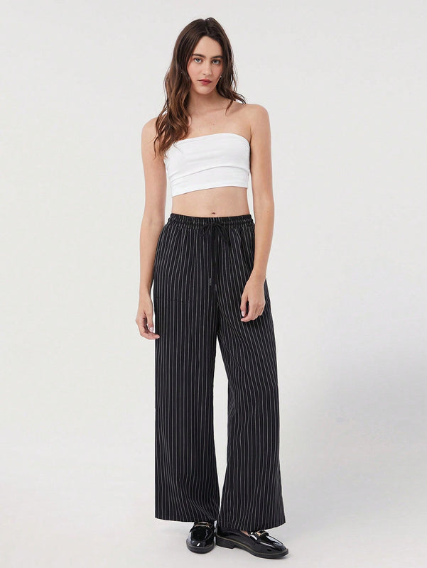 Pantalones sueltos de pierna ancha de color solido para mujer con dobladillo fluido, estilo casual