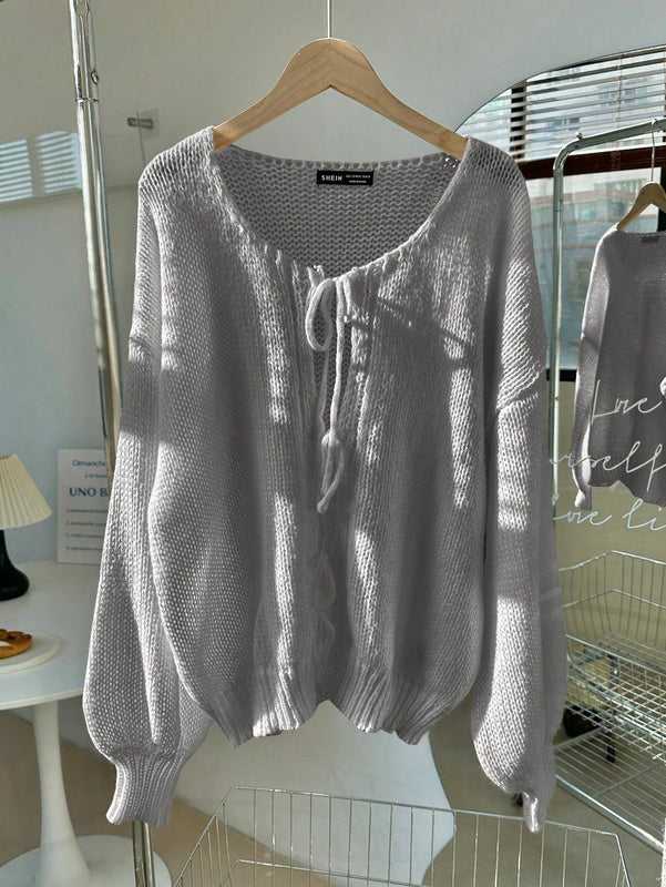 Frenchy cardigan de punto unicolor de color rosa palido con cinturon delantero, se puede usar sobre una camiseta