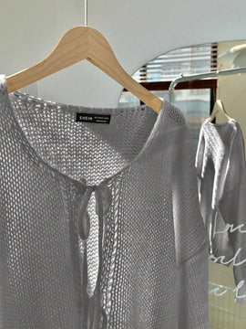Frenchy cardigan de punto unicolor de color rosa palido con cinturon delantero, se puede usar sobre una camiseta