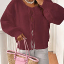 Frenchy cardigan de punto unicolor de color rosa palido con cinturon delantero, se puede usar sobre una camiseta