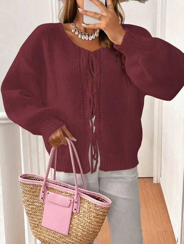 Frenchy cardigan de punto unicolor de color rosa palido con cinturon delantero, se puede usar sobre una camiseta