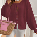 Frenchy cardigan de punto unicolor de color rosa palido con cinturon delantero, se puede usar sobre una camiseta