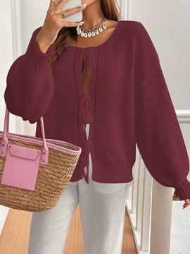 Frenchy cardigan de punto unicolor de color rosa palido con cinturon delantero, se puede usar sobre una camiseta