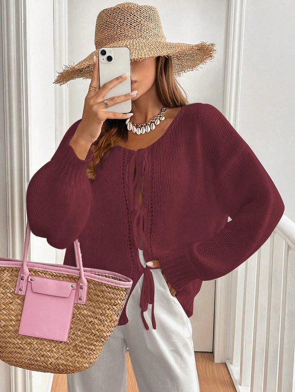 Frenchy cardigan de punto unicolor de color rosa palido con cinturon delantero, se puede usar sobre una camiseta