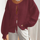 Frenchy cardigan de punto unicolor de color rosa palido con cinturon delantero, se puede usar sobre una camiseta