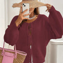 Frenchy cardigan de punto unicolor de color rosa palido con cinturon delantero, se puede usar sobre una camiseta