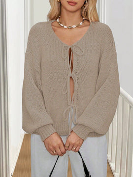 Frenchy cardigan de punto unicolor de color rosa palido con cinturon delantero, se puede usar sobre una camiseta