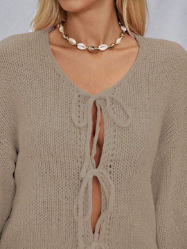 Frenchy cardigan de punto unicolor de color rosa palido con cinturon delantero, se puede usar sobre una camiseta