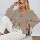 Frenchy cardigan de punto unicolor de color rosa palido con cinturon delantero, se puede usar sobre una camiseta