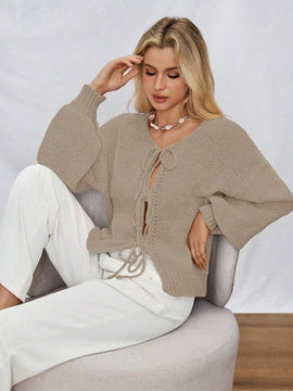 Frenchy cardigan de punto unicolor de color rosa palido con cinturon delantero, se puede usar sobre una camiseta