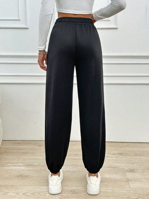 Pantalones jogger de mujer de bolsillo diagonal de unicolor