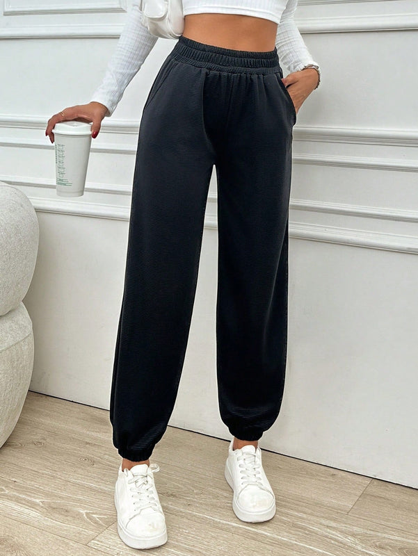 Pantalones jogger de mujer de bolsillo diagonal de unicolor