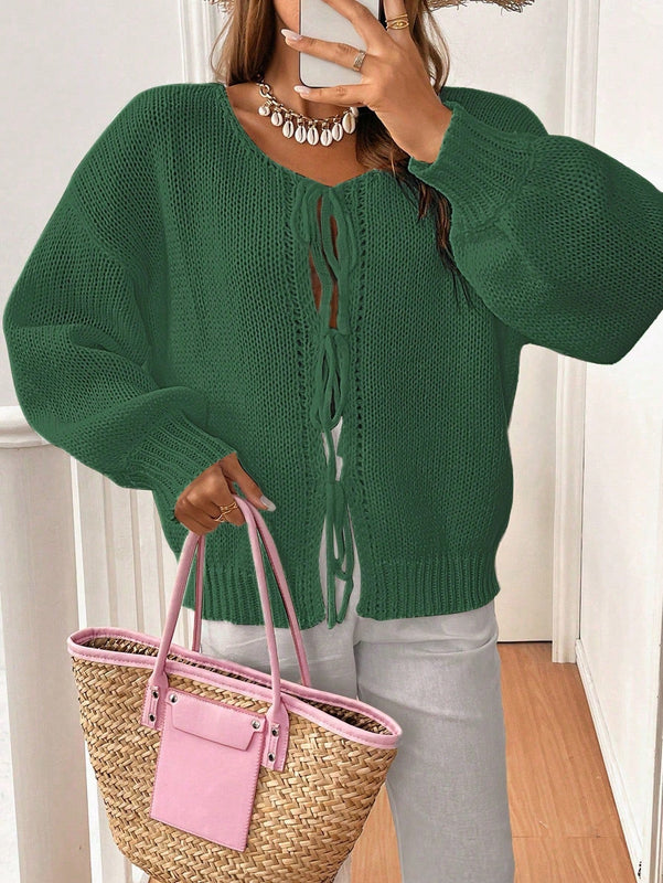 Frenchy cardigan de punto unicolor de color rosa palido con cinturon delantero, se puede usar sobre una camiseta
