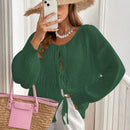 Frenchy cardigan de punto unicolor de color rosa palido con cinturon delantero, se puede usar sobre una camiseta