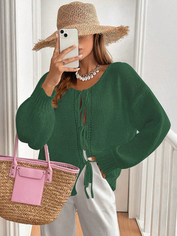 Frenchy cardigan de punto unicolor de color rosa palido con cinturon delantero, se puede usar sobre una camiseta