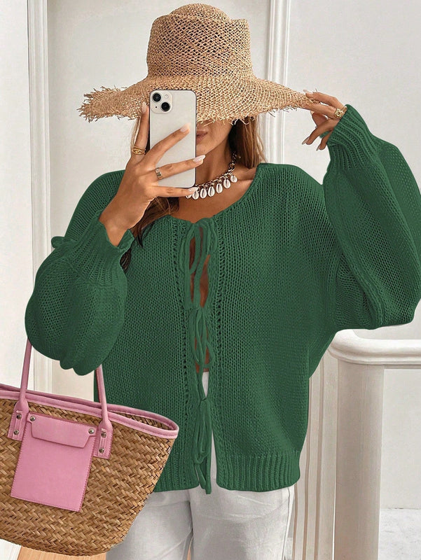 Frenchy cardigan de punto unicolor de color rosa palido con cinturon delantero, se puede usar sobre una camiseta
