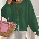 Frenchy cardigan de punto unicolor de color rosa palido con cinturon delantero, se puede usar sobre una camiseta