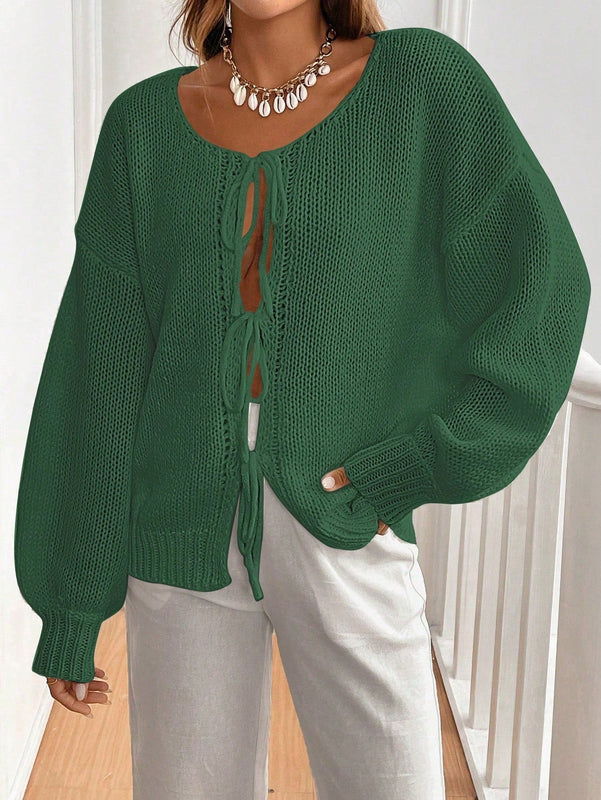 Frenchy cardigan de punto unicolor de color rosa palido con cinturon delantero, se puede usar sobre una camiseta