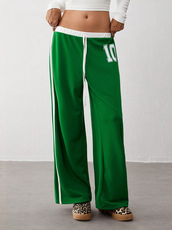 Trndy pantalones anchos de mujer con bloques de color y rayas de estilo deportivo de talla baja, corte holgado adecuado para otono/invierno