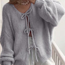 Frenchy cardigan de punto unicolor de color rosa palido con cinturon delantero, se puede usar sobre una camiseta